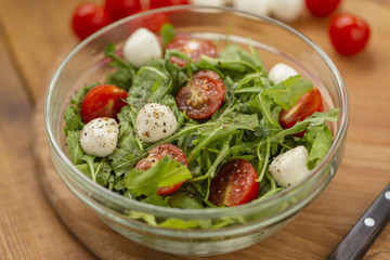 Arugula with mozzarella, tomatoes and olive oil, Caprese salad.