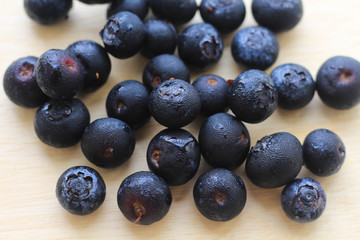 Blueberries on wooden table.