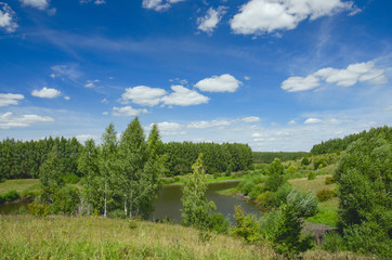 Sunny summer landscape with green hills,river curve and beautiful woods on a nice day.Tula region,Russia