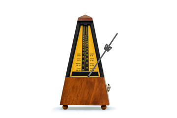 mechanical brown antique metronome on white