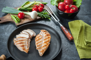 Grilled chicken fillet on frying pan