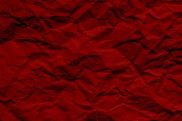 Red background and wallpaper by crumpled paper texture and free space.