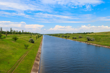 Fototapeta premium View on the irrigation canal on summer