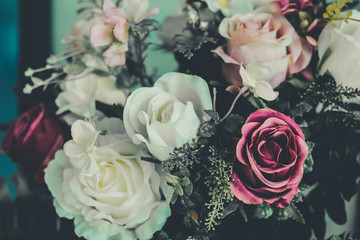Bouquet of red and white roses. Retro filter.