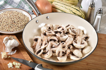 Fototapeta premium Sliced mushrooms in a skillet