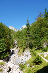 Fototapeta na wymiar Hiking trail leading from Lago del Predil to Bivacco Gorizia and Cima delle Forcelle in Dolomites, Alps, Italy