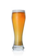 Single glass of cold light beer with foam