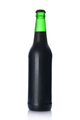Single bottle of cold dark beer with drops