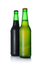 Two bottles of cold dark and light beer with drops