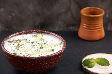Turkish national dish - homemade cold yogurt with seasonings and mint