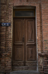 Vintage door on brick wall