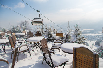 Outdoor mountain cafe in winter season,  Poland, ski resort Zakopane, Polana Szymoszkowa, mountains of Polish Tatras
