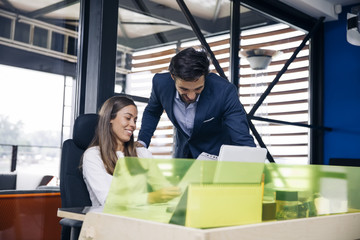 Business couple working together on project at modern startup office