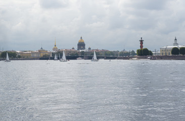 view of St. Petersburg, yachts on the Neva, the Dome of St. Isaac's Cathedral, Neva river, Admiralty spire, Rostral column