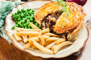 Homemade beef stew pie with french fries