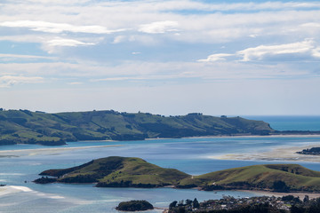 Grassy islands with cloudy sky