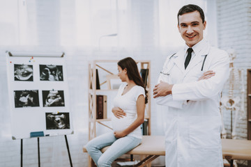 Obraz premium Doctor Posing . Pregnant Woman. Consultation.