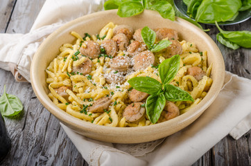 Homemade spaetzle, barbecue sausage and fresh cheese