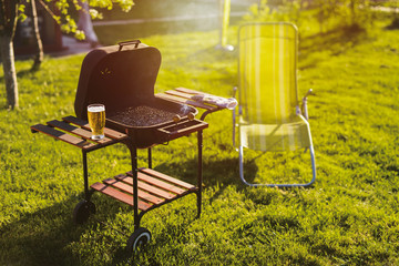 Picture of empty barbeque grill prepared for use.