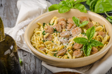 Homemade spaetzle, barbecue sausage and fresh cheese