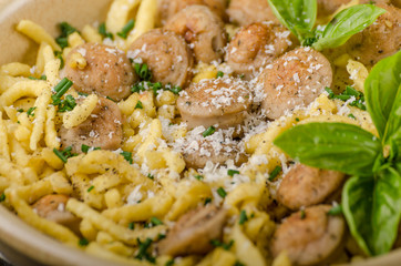 Homemade spaetzle, barbecue sausage and fresh cheese