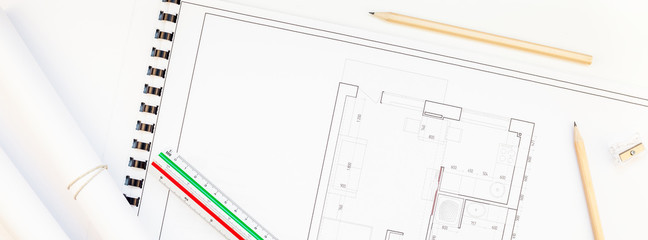 Interior designer table workplace with house plan
