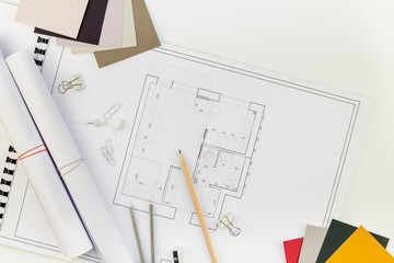 Interior designer table workplace with house plan