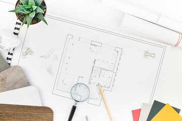 Interior designer table workplace with house plan