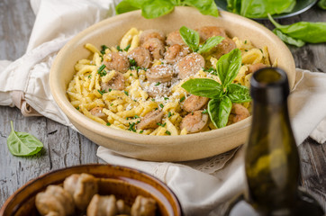 Homemade spaetzle, barbecue sausage and fresh cheese