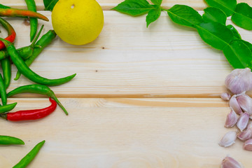 Vegetables, fruits and herbs for cooking on the table.
