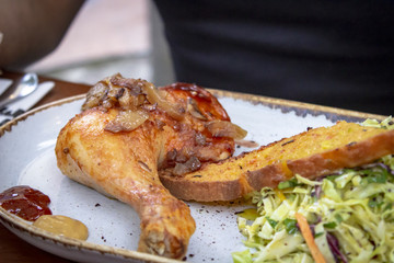 Close-up shoot of grill chicken and salad on table