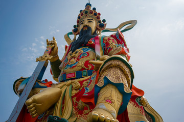 Closeup of statue of taoist god Xuan Tian Shang Di at lotus pond Kaohsiung Taiwan
