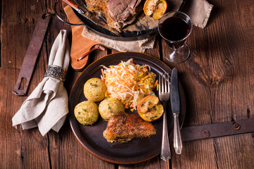 classic and crispy roasted duck with cabbage and dumplings