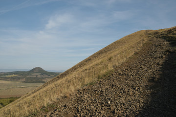 Mila hill on background viewed from Rana hill in Czech central mountains tourist area at sunrise on 16th September 2018