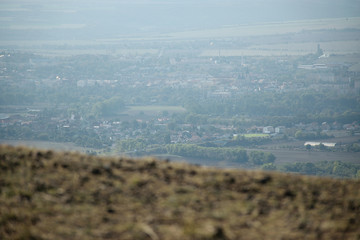 Louny city viewed from Rana hill in Czech central mountains tourist area at sunrise on 16th September 2018