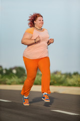 Beautiful young fat woman is runing