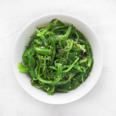 Wakame seaweed salad with sesame seed. Traditional Japanese food. Top view. 