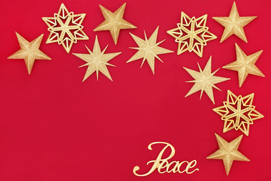 Christmas Abstract Background With Gold Glitter Bauble Decorations And Peace Sign On Red With Copy Space.  Traditional Festive Card For The Christmas Holiday Season. 