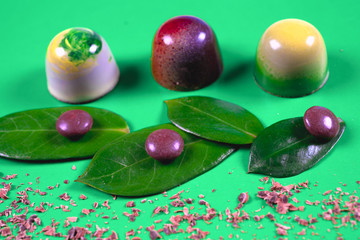 Top view of set of beautiful and delicious chocolate sweets decorated with assorted chocolate crumbs