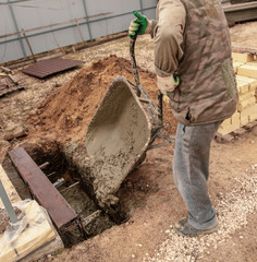 Concrete in a wheelbarrow at a construction site