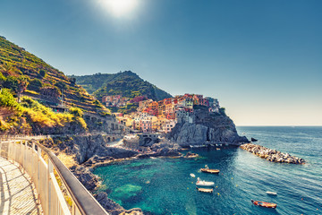 Beautiful landscape of famous Manarola village in Cinque Terre, Italy on a summer day. Scenic panorama view.