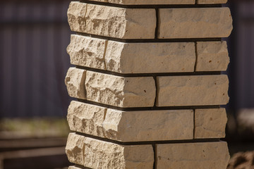 Brick posts on a fence as a background