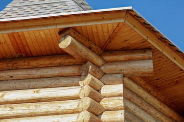 House with log house against the blue sky