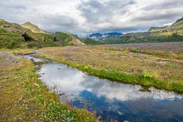Glacial river in the dramatically beautiful and surreal landscapes of Thorsmork valley in the Highlands of Iceland at southern end of the famous Laugavegur hiking trail.