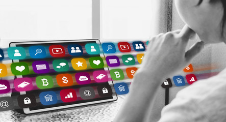 Online media and application technology on digital tablet. a man using online media application on digital tablet