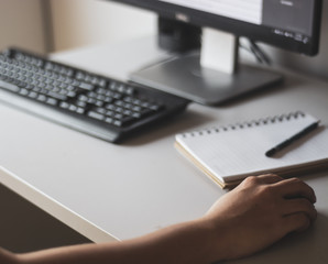 Working at home with personal computer and hands on the keyboard and mouse