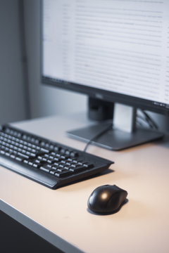 Working at home with personal computer and hands on the keyboard and mouse