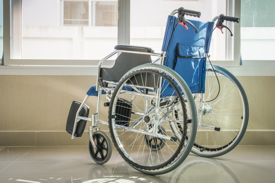 A wheelchair, side view photo
