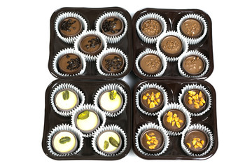 Chocolate candies on a white background, isolate. Exclusive expensive sweets with different...
