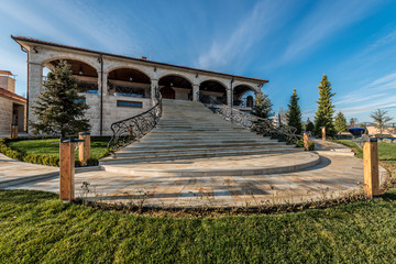 Exterior of mansion with marble staircases